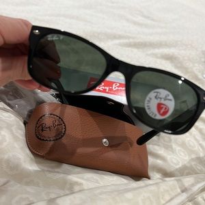 Brand new in box, giftable. Wayfarer 2132, polarized